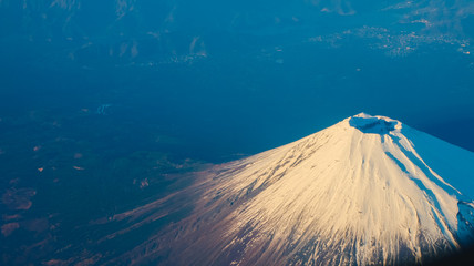 Beautiful Fuji Mountain viewed from airplane in early winter season.