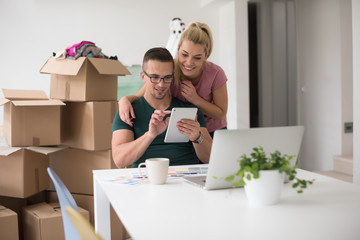 Young couple moving in a new home