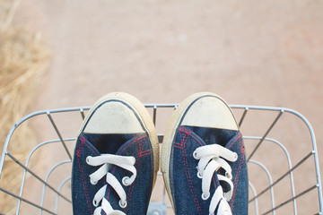 Jeans sneakers in basket ,hipster tone