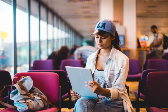 Young Woman Waiting At Airport Lounge