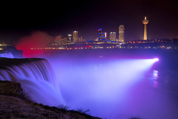 Fototapeta na wymiar Violet light shining on Niagara Falls 