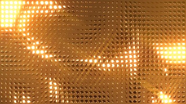 Rotating glittering golden coins on brown background.  All that glitters is gold. Perfect loop.