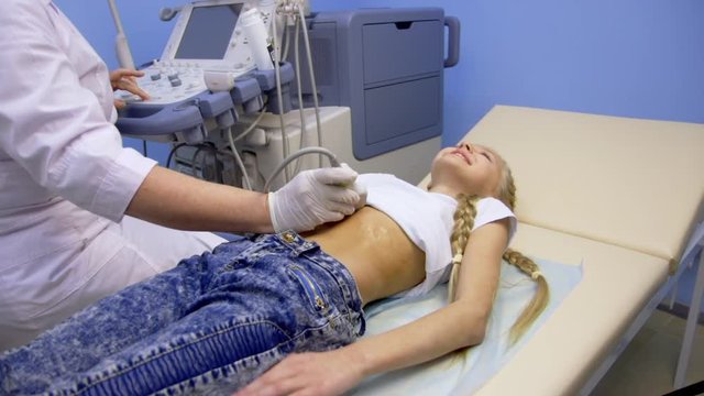 girl in the hospital doing ultrasound