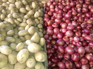 Directly above shot of onions and potatoes for sale
