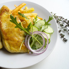 Turkey steak on a wooden Board. on white background