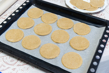 Raw oatmeal cookies on baking sheet