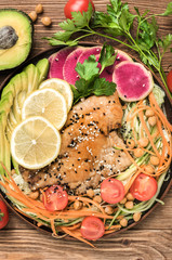 Fish with mixed vegetable and avocado .