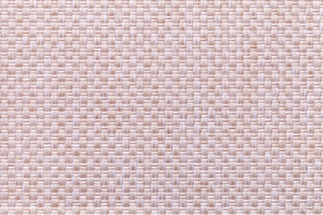 Pink background with checkered pattern, closeup. Structure of the fabric macro.