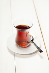 Cup of tea on a white wooden background