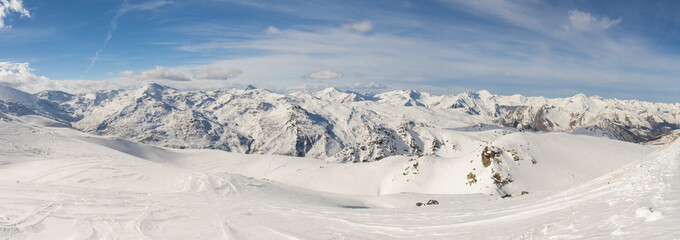 Panoramic view of mountain range with ski piste