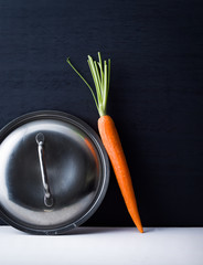 Carrot and pot lid