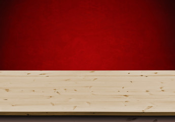 Empty wooden table for product display over grunge red wall