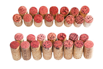 Cork from bottles of red wine from the region Rioja isolated on white background. Corks laid out in...