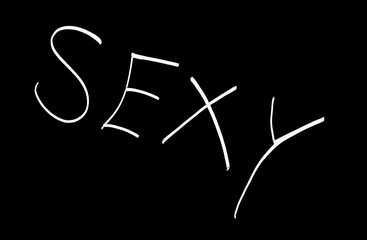 Sexy Symbol auf schwarzer Tafel