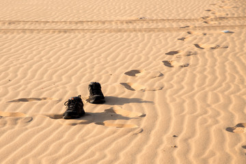 Kick off shoes and walking on white sand.