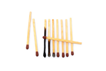 Laid used matchsticks isolated on white background