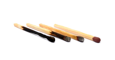 Laid used matchsticks isolated on white background