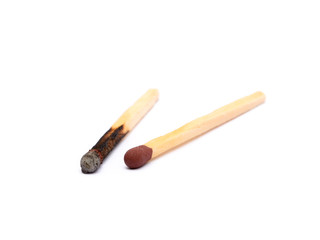 Laid used matchsticks isolated on white background