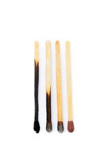 Laid used matchsticks isolated on white background