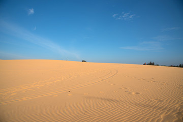 White sand dune with blue sky background at Mui Ne city, Vietnam
