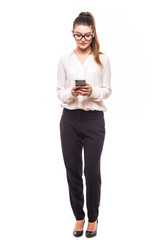 Beautiful young businesswoman holding mobile phone