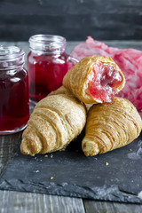 Fresh croissants with fruit tea
