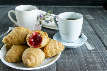 Fresh croissants with fruit tea
