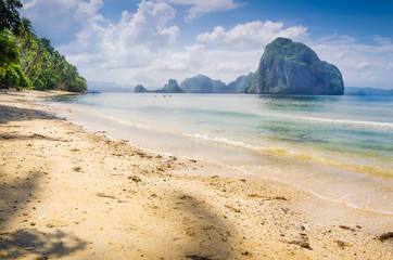 Landscape of El Nido. Sandy Beach with Huge Rock, Palawan island. Philippines