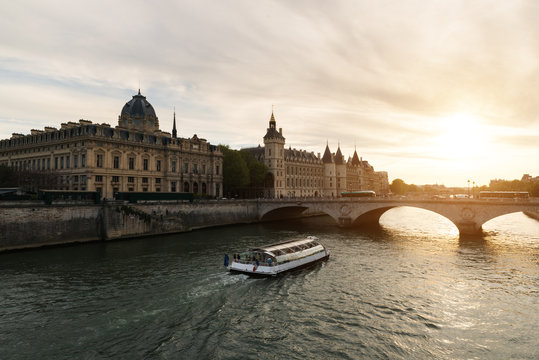 Boat tour on Seine river in Paris with sunset. Paris, France..