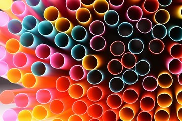 Drinking straws. Macro abstract image with beautiful multi-colored background.