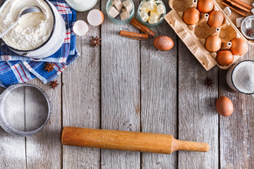 Fototapeta na wymiar Baking ingredients on rustic wood background