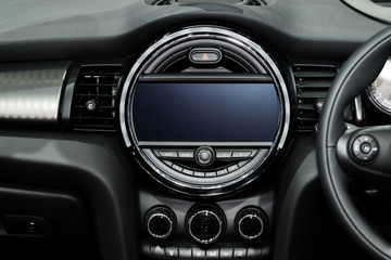 Obraz na płótnie Canvas Interior view of car. Modern technology car dashboard, radio and aircondition control button.