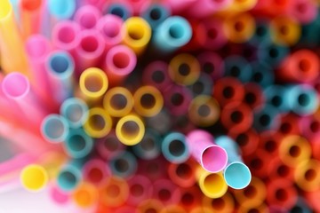 Drinking straws. Macro abstract image with beautiful multi-colored background.