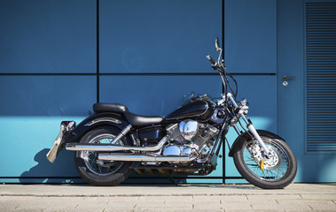Obraz na płótnie Canvas A classic Motorbike in parked in the Sunshine