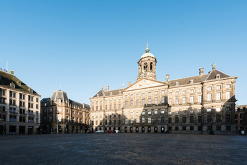 Fototapeta premium Royal Palace at the Dam Square in Amsterdam, Netherlands. No people in Dam Square in Amsterdam, Netherlands.