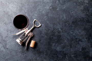 Red wine glass and corkscrew