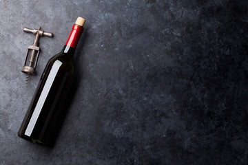 Red wine bottle and corkscrew