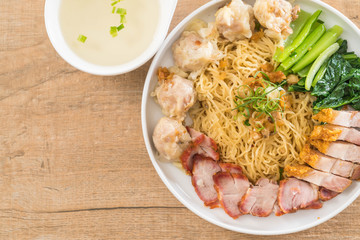 Egg noodle with red roast pork, crispy pork, dumplings and soup