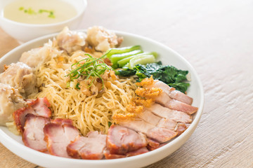 Egg noodle with red roast pork, crispy pork, dumplings and soup