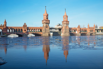 Berlin - The Oberbaum bridge and the block of ice on the Spree river.