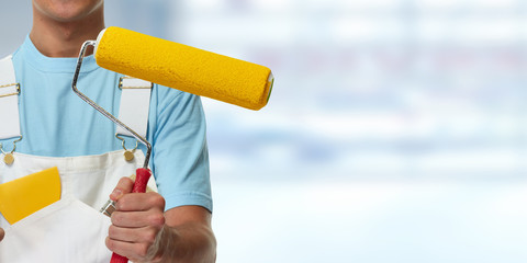 hand with painting roller