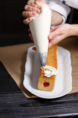 female hands holding piping bag