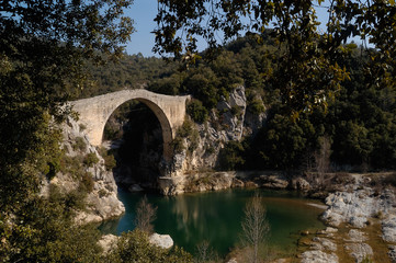 Fototapeta na wymiar Romanesque bridge of Llierca river, Sales de Llierca, Girona province, Catalonia, Spain