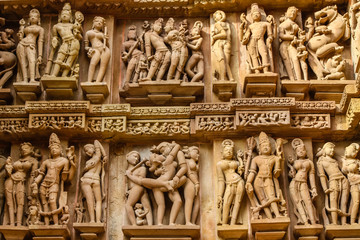 Close up of artful ancient carvings, Khajuraho Group of Monuments, India