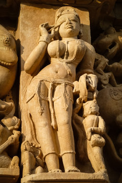 Close up of artful ancient sculpture, Khajuraho Group of Monuments, India