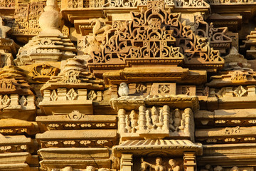 Close up of artful carved walls of Kandariya Mahadeva Temple, Khajuraho Group of Monuments, India