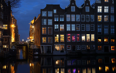 Mansions at night in Amsterdam, Holland - obrazy, fototapety, plakaty