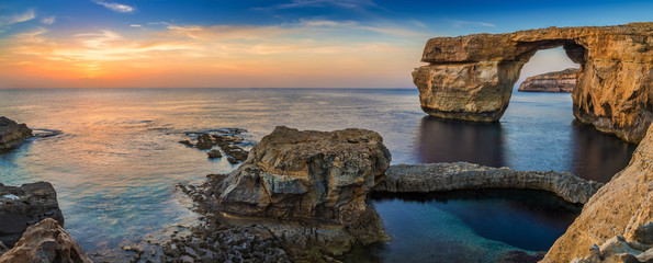 Fototapeta premium Gozo, Malta - Panoramic view of the beautiful Azure Window, a natural arch and famous landmark on the island of Gozo at sunset