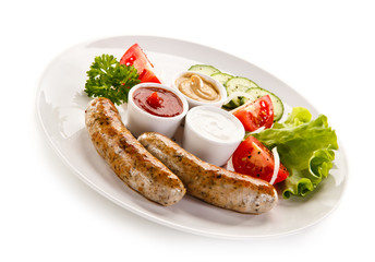 Breakfast - fried white sausages and vegetables 