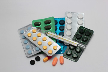  blue red white pills on grey background